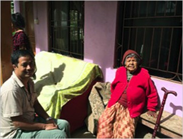 A nursing home resident with one of the staff